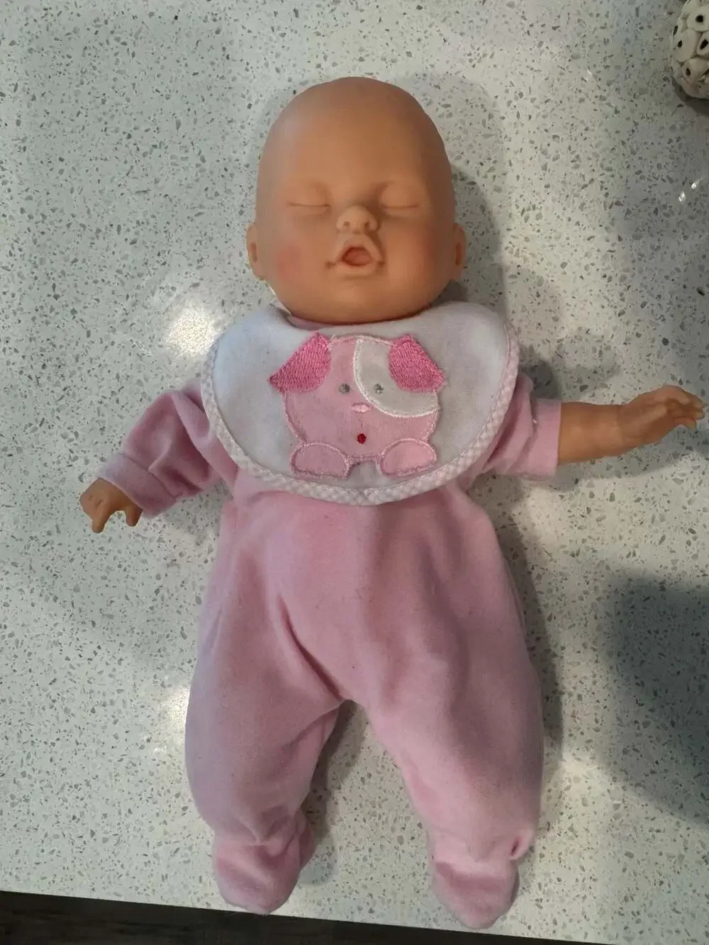 Soft Body Baby Doll with Vinyl Head and Pink Animal Applique Bib